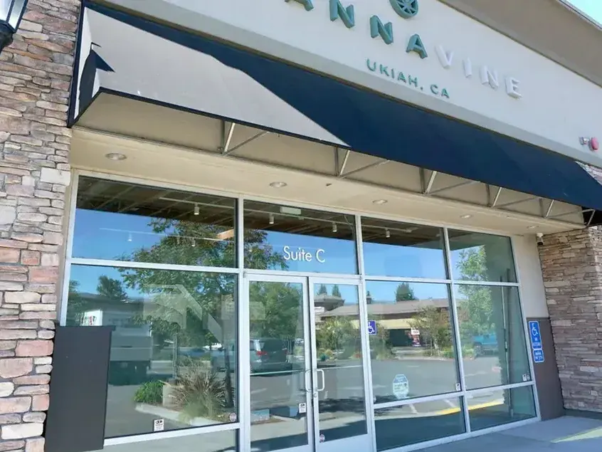 Cannavine Ukiah storefront with sign, awning, and glass windows on sunny day